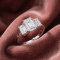 18K Trilogy Emerald Cut Diamond Ring — AI cloth, in-house